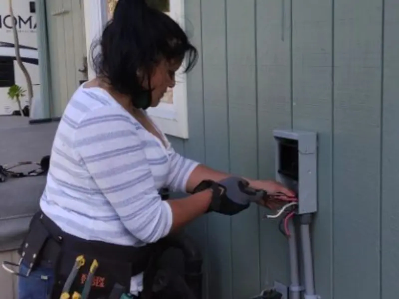 Licensed electrician wiring an exterior subpanel in Idabel